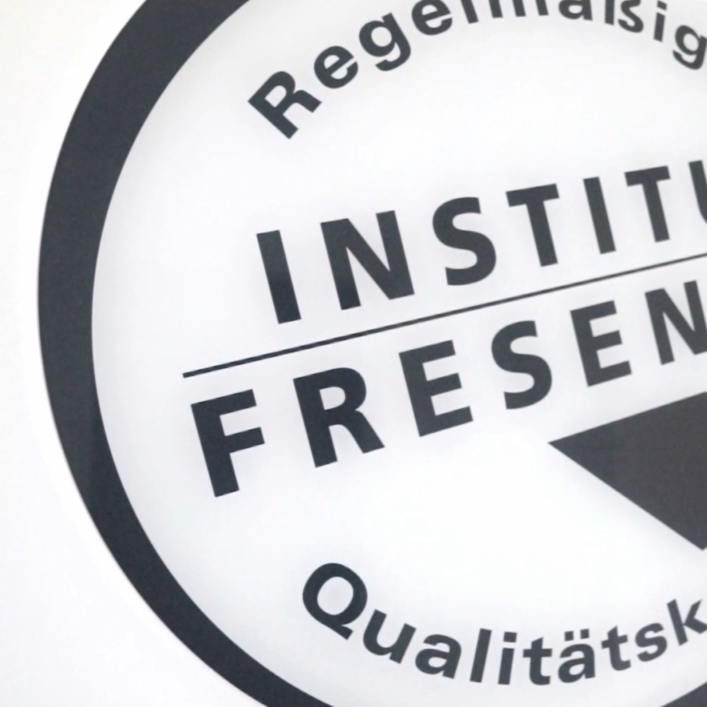 A sign bearing the Institut Fresenius seal for regular quality control