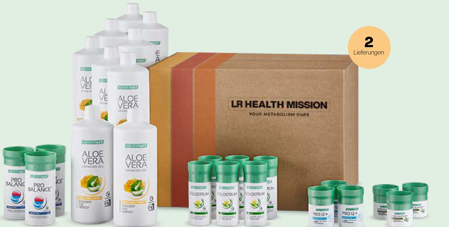 The LR Health Mission package: Aloe Vera Drinking Gels, Colostrum, PRO 12+, Liver Support and Pro Balance in front of a cardboard box
